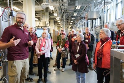 Alumni visitors receive a tour of the pilot plant