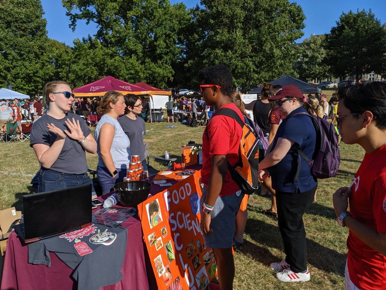 Members of the Food Science Club talk to prospective club recruits during Gobblerfest.