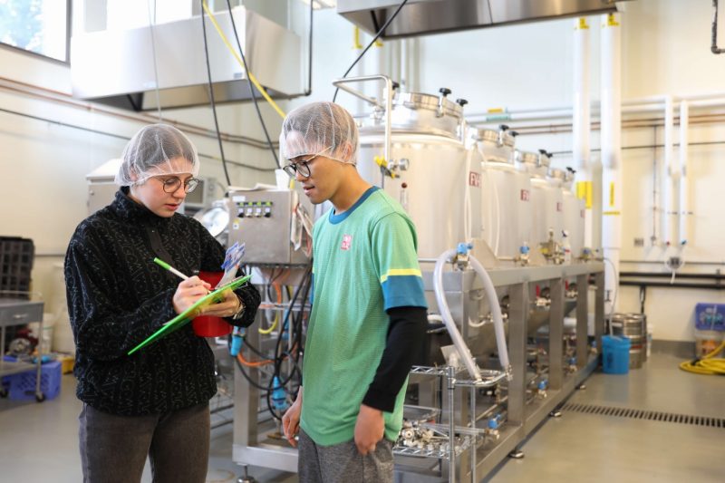 Two people in the Food Processing Pilot Plant